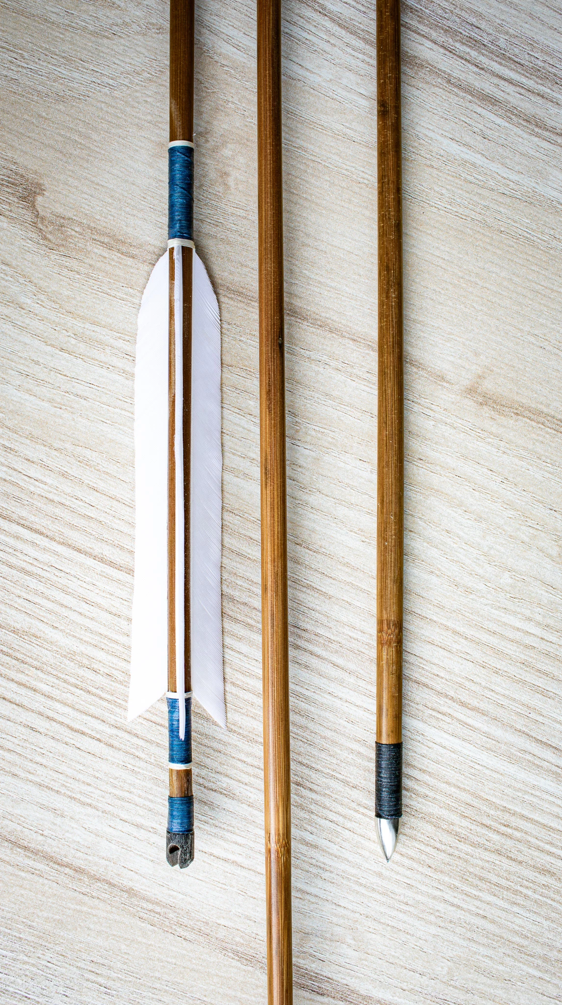 handmade wooden arrows with natural feathers